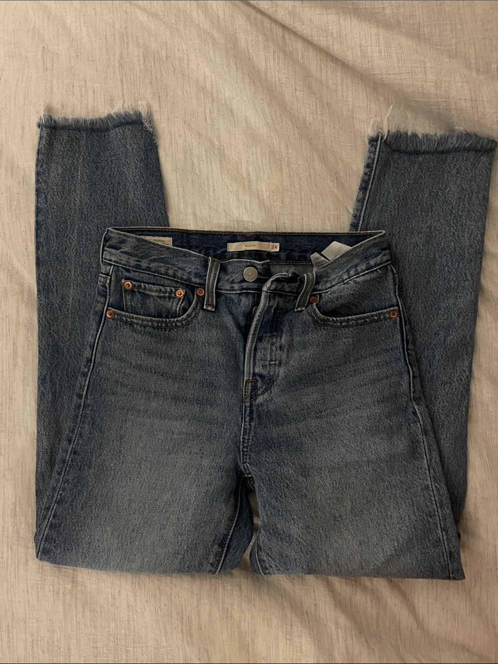 Levi's light medium blue wash Wedgie mid-rise jeans